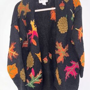 Autumn Leaf Patterned Black Cardigan by knitting needles